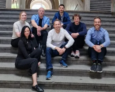 amplifold team sitting on stairs